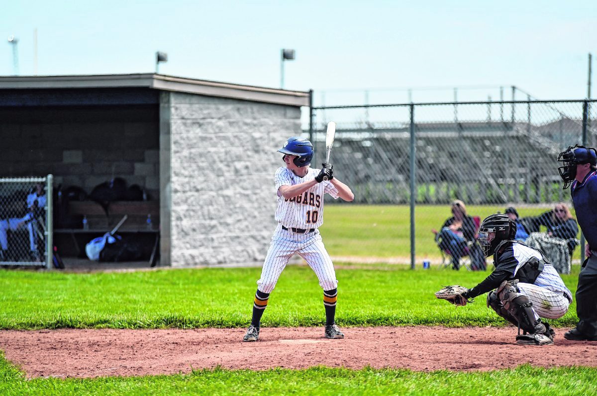 Trinity Lutheran's Andrew Bell waits for a pitch in the seventh inning of Saturday's game against Springs Valley. Bell got hit second hit of the day, drove in a run and scored to help the Cougars win 11-9.  Arv Koontz/ The Tribune