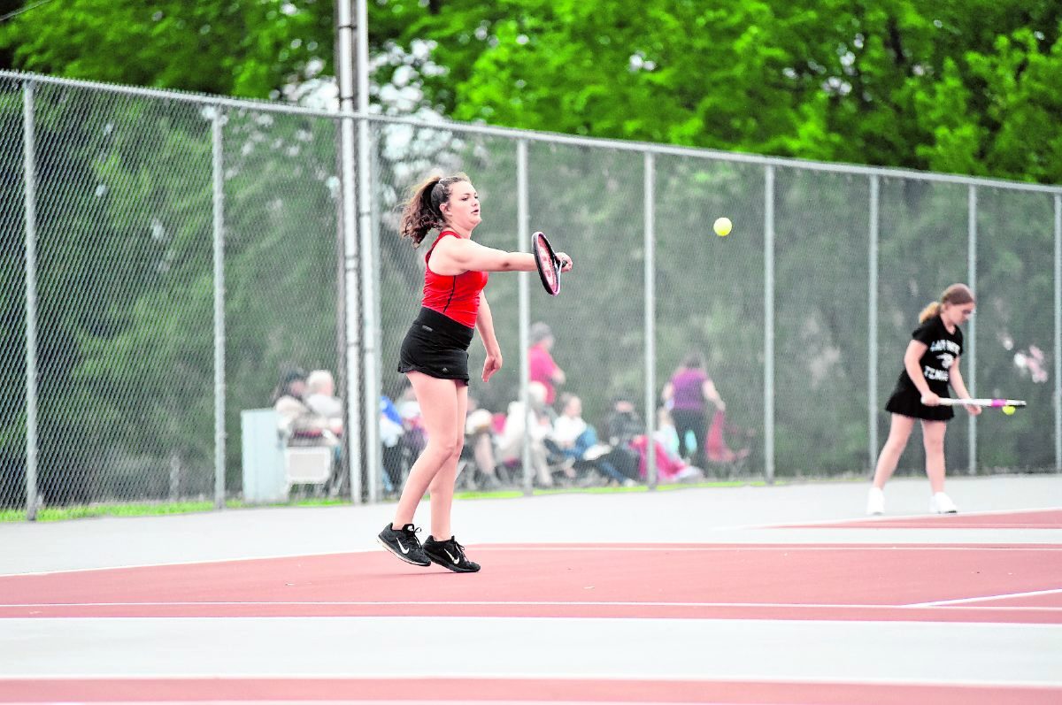 Brownstown Central's Emily Mann returns a forehand during her No. 2 singles match against Corydon's Emma Boone Thursday afternoon. Mann won 6-2, 6-1. Arv Koontz/ The Tribune