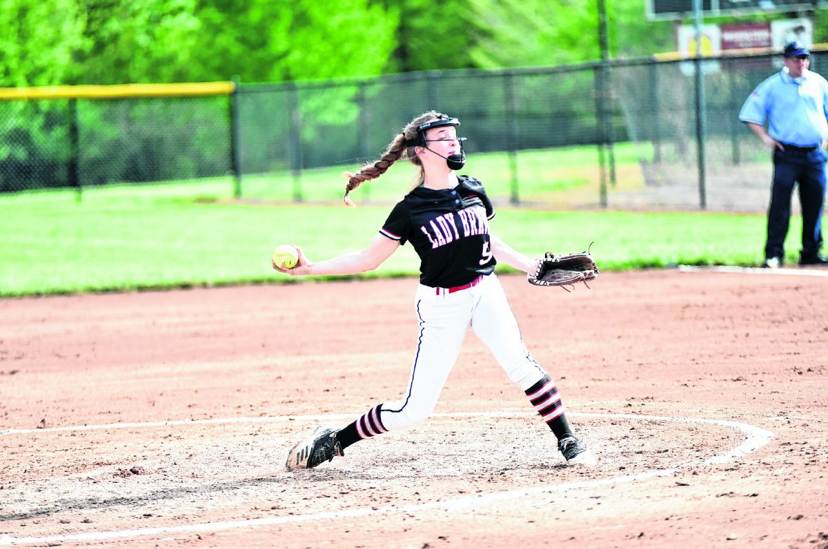 Brownstown Central's Kelsey Schneider pitches to a Floyd Central batter during Monday's game. She pitched the Braves to a 2-1 win. Arv Koontz/ The Tribune