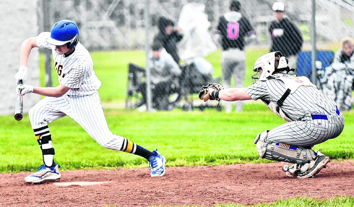 Trinity’s Peyton Pollert lays down a bunt during the Cougar Invitational on Saturday. Trinity dropped both of its games to Eastern (Pekin) and Borden.  Arv Koontz | The Tribune