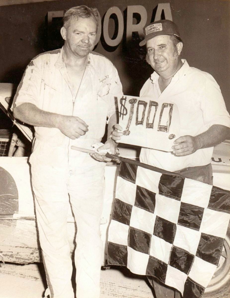 Columbus native Gene Petro receives congratulations from Eldora Speedway promoter Earl Baltes after receiving a $1,000 bonus for winning his 10th late model feature July 11, 1971. Baltes sold the track to Tony Stewart in 2004.  SUBMITTED