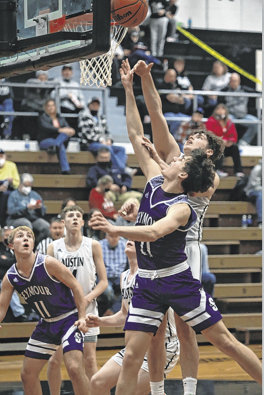 Forward Casey Regruth battles underneath for Seymour. Jennifer Regruth | For The Tribune