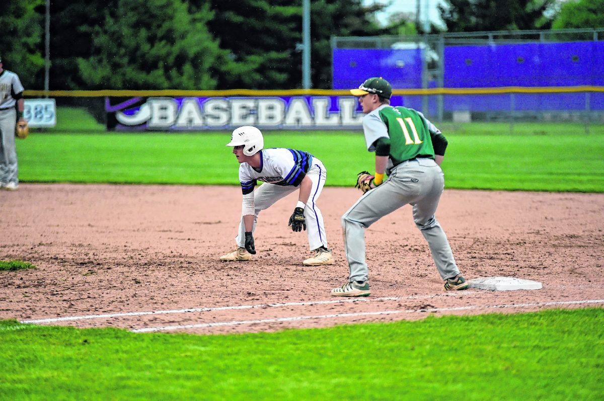 Seymour's Charlie Longmeier leads off first base in the third inning of Thursday's game against Floyd Central. Longmeier singled and scored on a hit by Bret Perry but the Owls lost 5-1. The Floyd Central first baseman is Dylan Hogan. Arv Koontz/ The Tribune