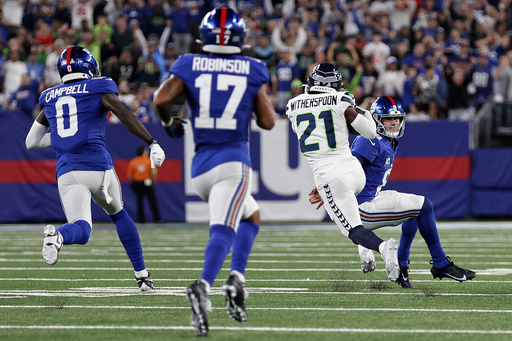 Rookie Devon Witherspoon scores on 97-yard pick-6 as Seahawks' defense  leads Seattle over Giants - Seymour Tribune