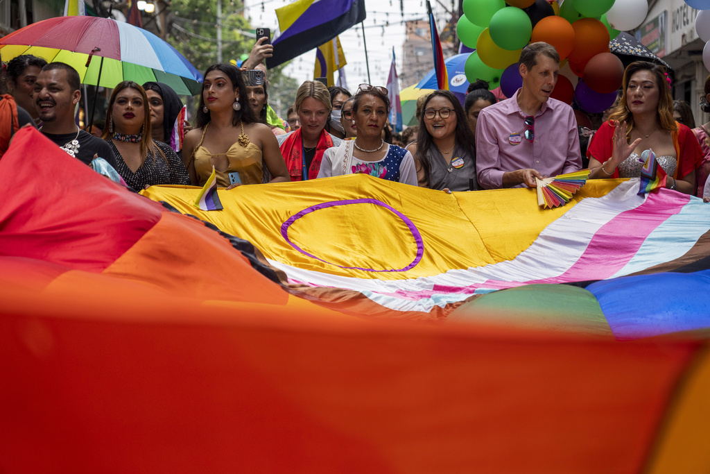 Samesex couples and LGBTQ+ activists rally in Nepal's capital during